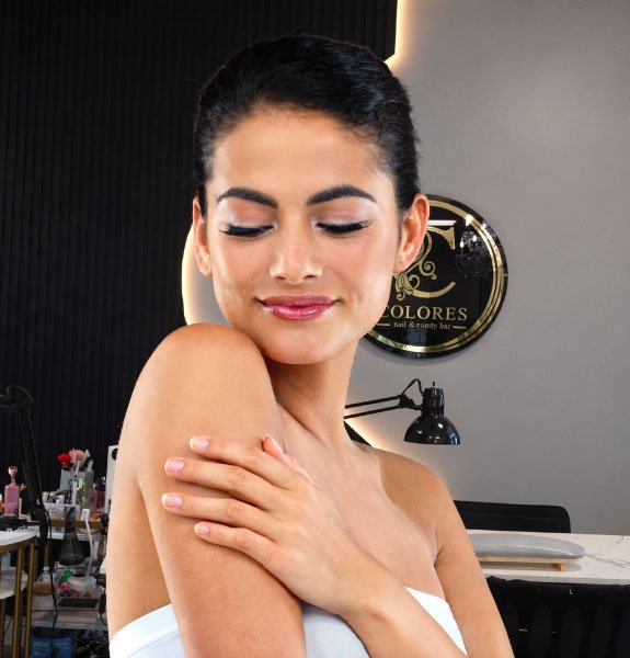 Woman receiving professional waxing treatment