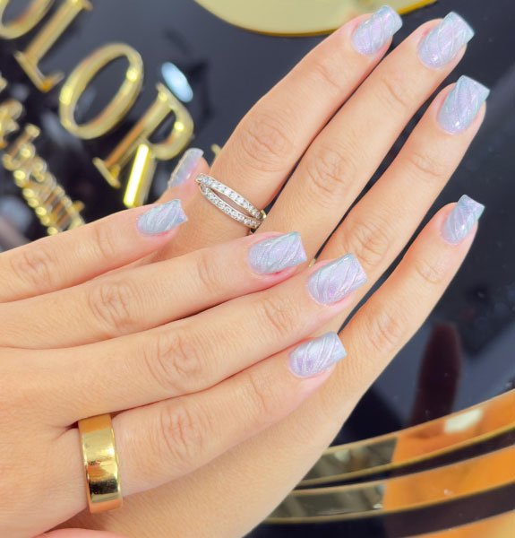 Light blue acrylic nails with glossy finish